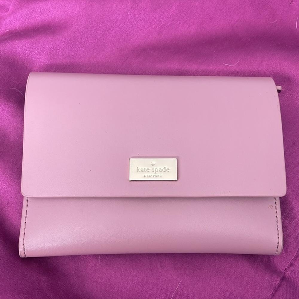 Gently used Dusty pink/purple wallet with silver hardware and burgundy interior.